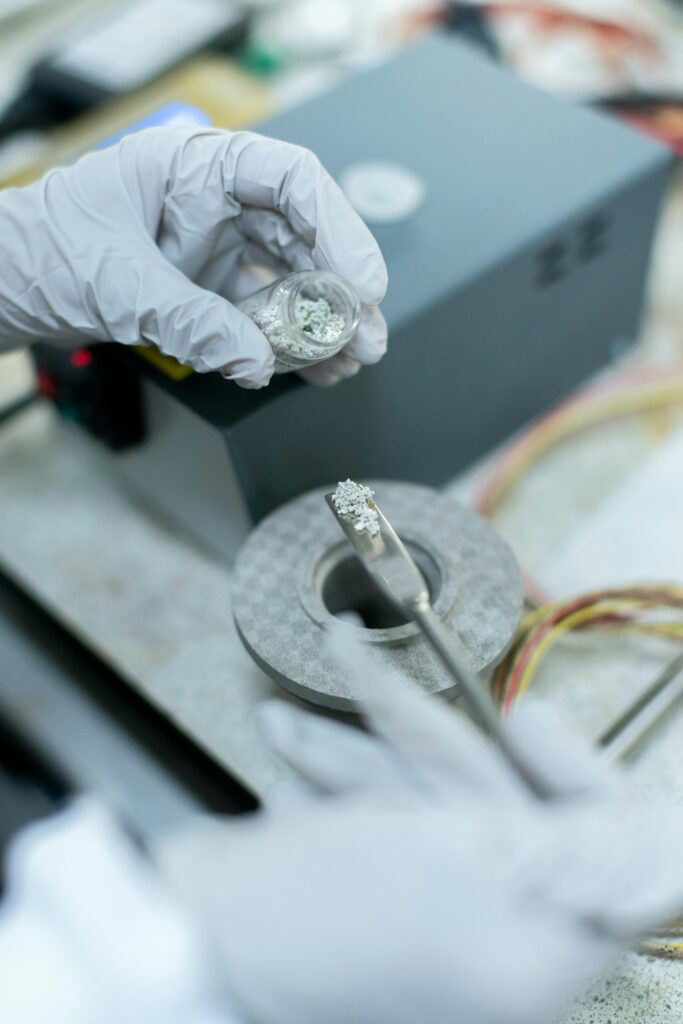 pexels photo 3861438 3861438 Close-up of a scientist handling metal samples in a laboratory experiment with precision tools.